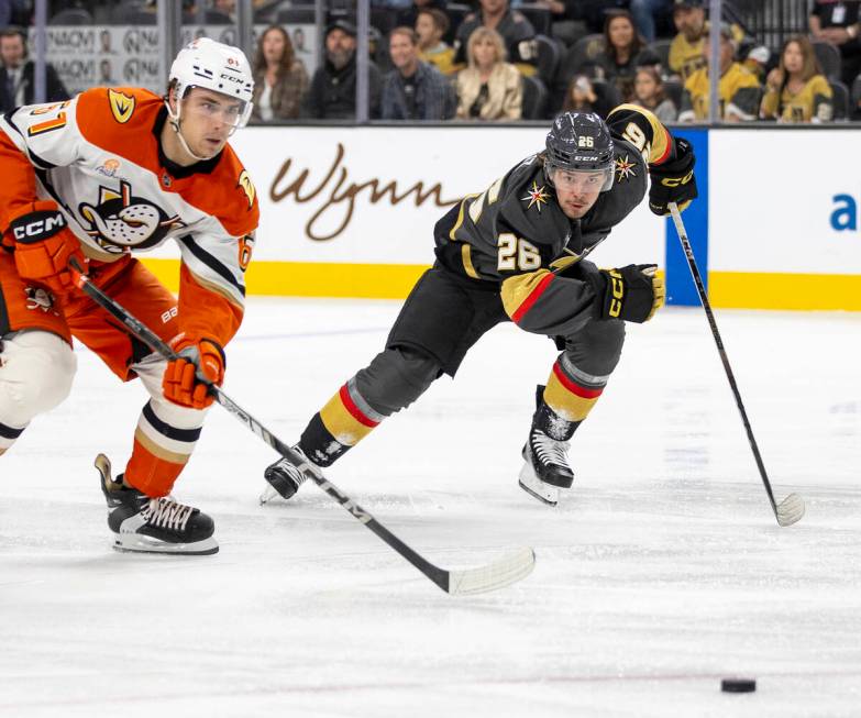 Golden Knights right wing Alexander Holtz (26) and Anaheim Ducks left wing Cutter Gauthier (61) ...