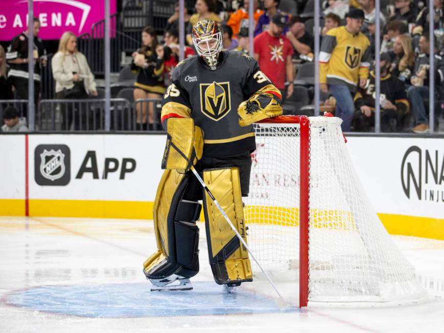 Golden Knights goaltender Ilya Samsonov (35) cleans his crease during the NHL hockey game again ...