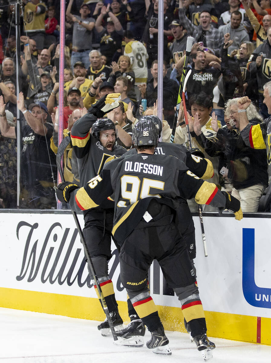 The Golden Knights celebrate a goal during the third period of the NHL hockey game against the ...