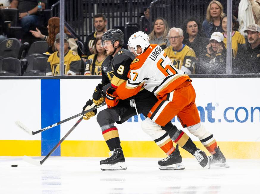 Golden Knights center Jack Eichel (9) competes for the puck with Anaheim Ducks defenseman Trist ...