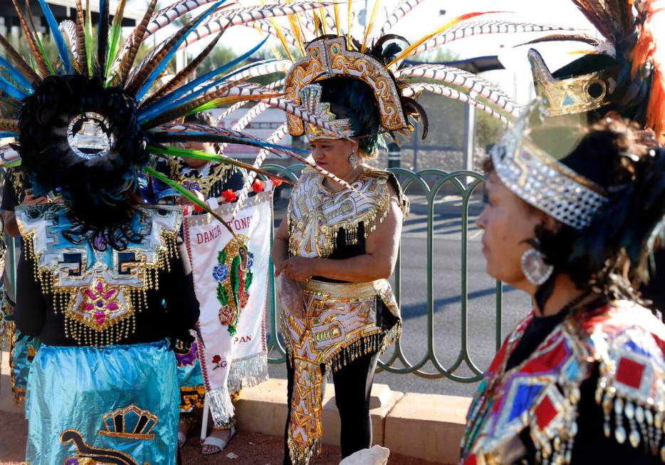 Members of the Danza Tonantzi Guadalupana Las Vegas dance group, including Arcely Metina, cente ...