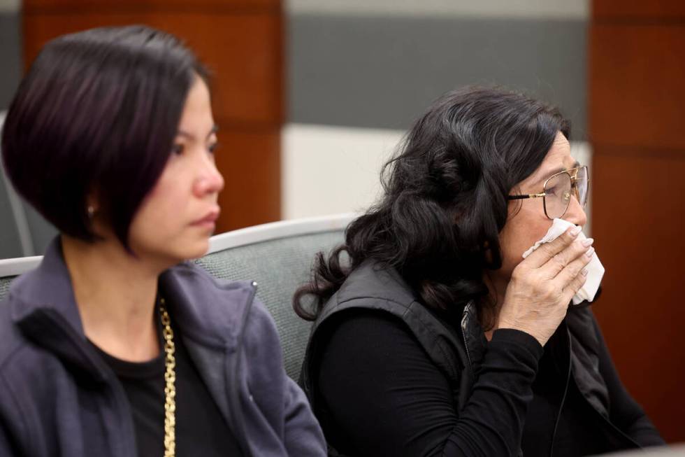 Family members of Sang Boi Nghia and Khoung Ba Le Nguyen react during the murder trial of Juliu ...