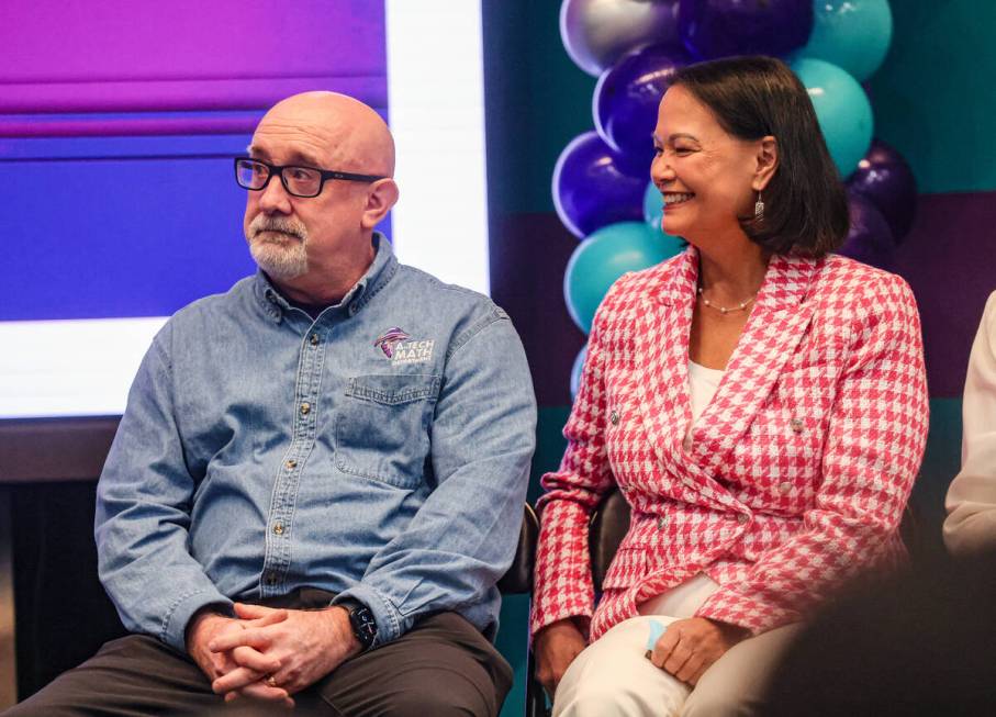 Math teacher Mike Patterson, sitting next to Superintendent of Public Instruction Jhone Ebert, ...