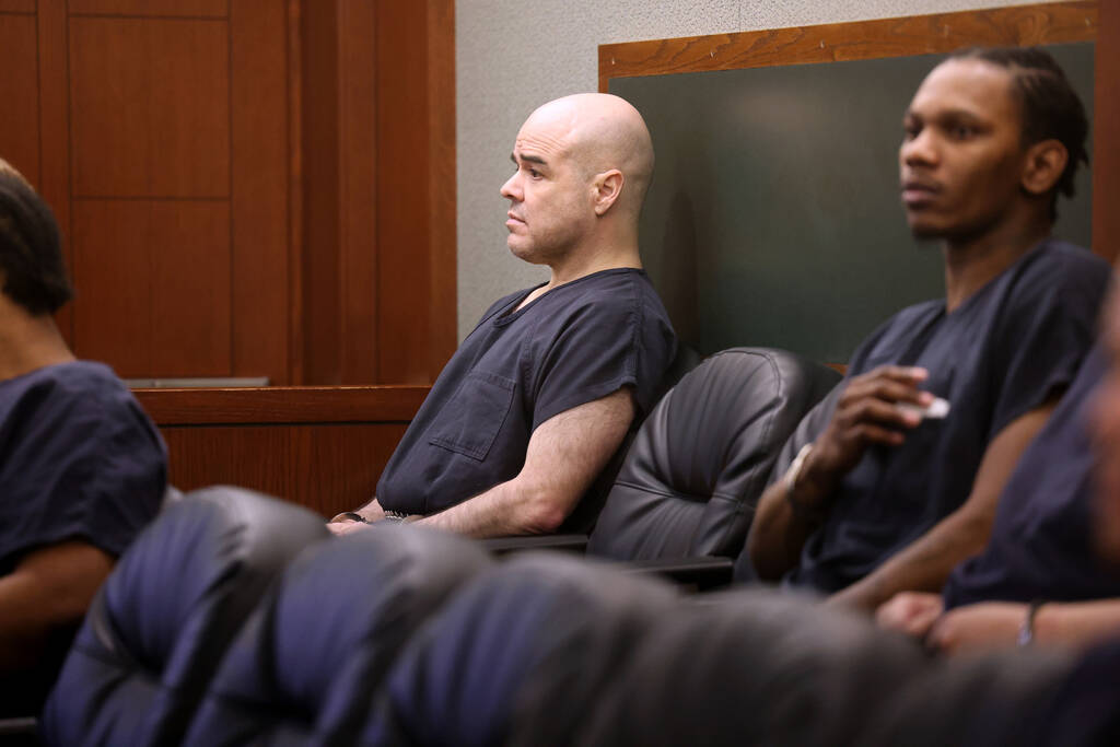 Robert Telles, center, waits in the courtroom before a hearing at the Regional Justice Center i ...