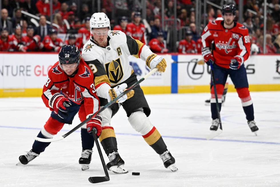 Washington Capitals defenseman Rasmus Sandin, left, and Vegas Golden Knights center Jack Eichel ...