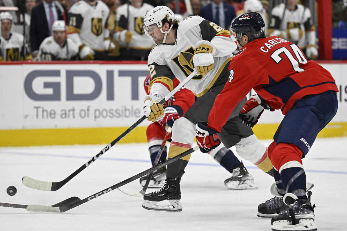 Vegas Golden Knights right wing Cole Schwindt, left, shoots the puck against Washington Capital ...