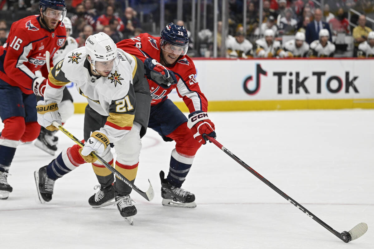 Vegas Golden Knights center Brett Howden (21) has his pass blocked by Washington Capitals cente ...