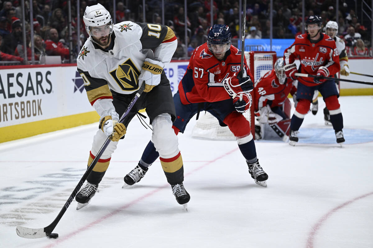 Vegas Golden Knights center Nicolas Roy (10) moves the puck against Washington Capitals defense ...