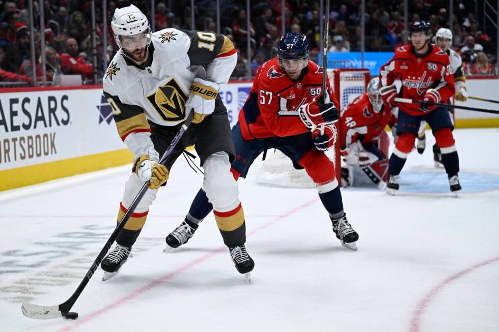 Vegas Golden Knights center Nicolas Roy (10) moves the puck against Washington Capitals defense ...