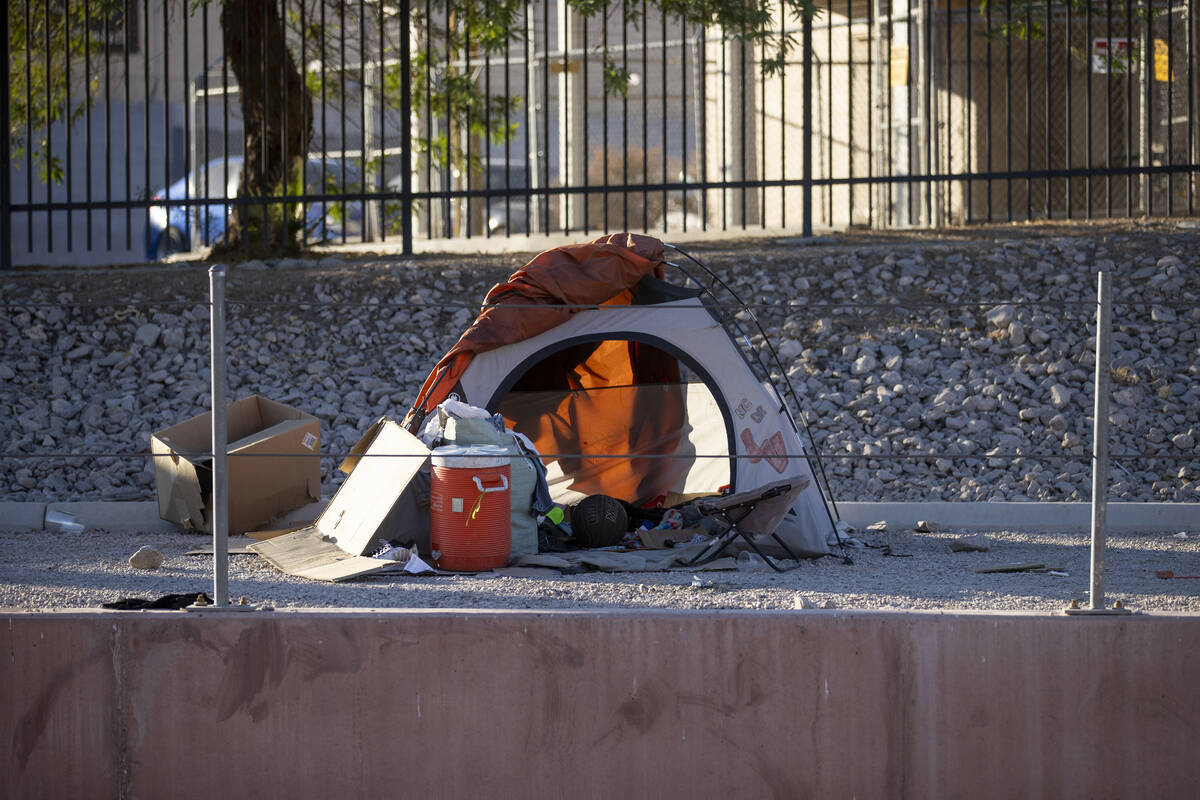 Tents sit along the Flamingo Wash near Desert Inn and Sandhill Roads Tuesday, Oct. 15, 2024, in ...