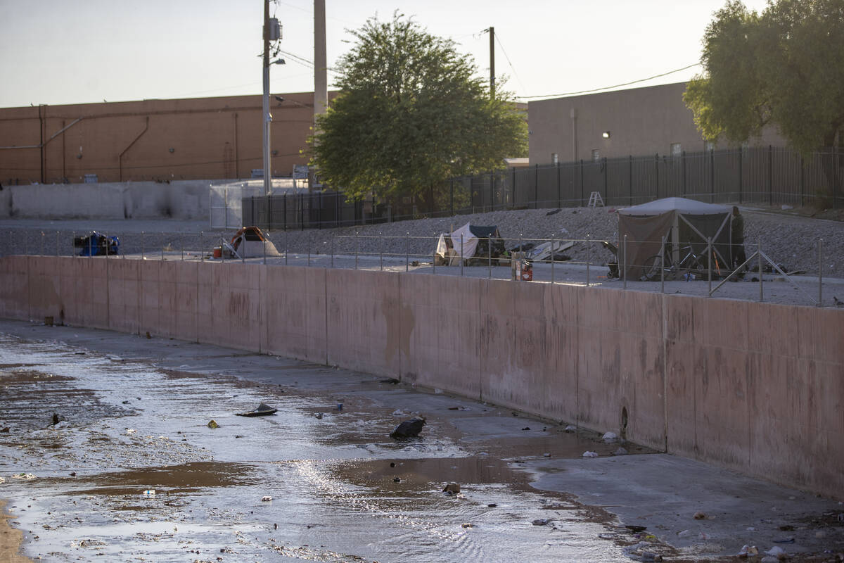 Tents sit along the Flamingo Wash near Desert Inn and Sandhill Roads Tuesday, Oct. 15, 2024, in ...