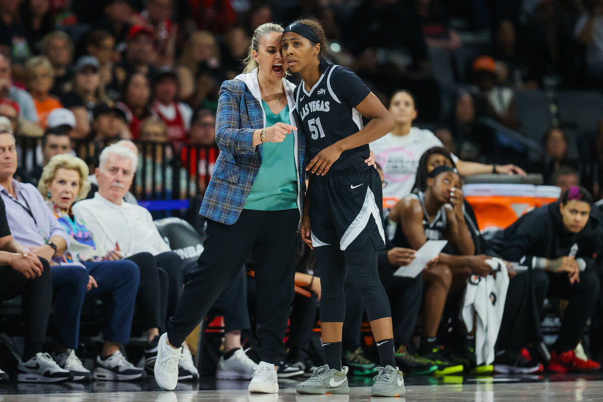 Aces head coach Becky Hammon coaches Aces guard Sydney Colson (51) during a WNBA basketball ga ...