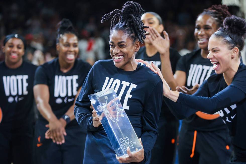 Aces guard Tiffany Hayes (15) celebrates with Alysha Clark, right, after winning the WNBA Sixth ...