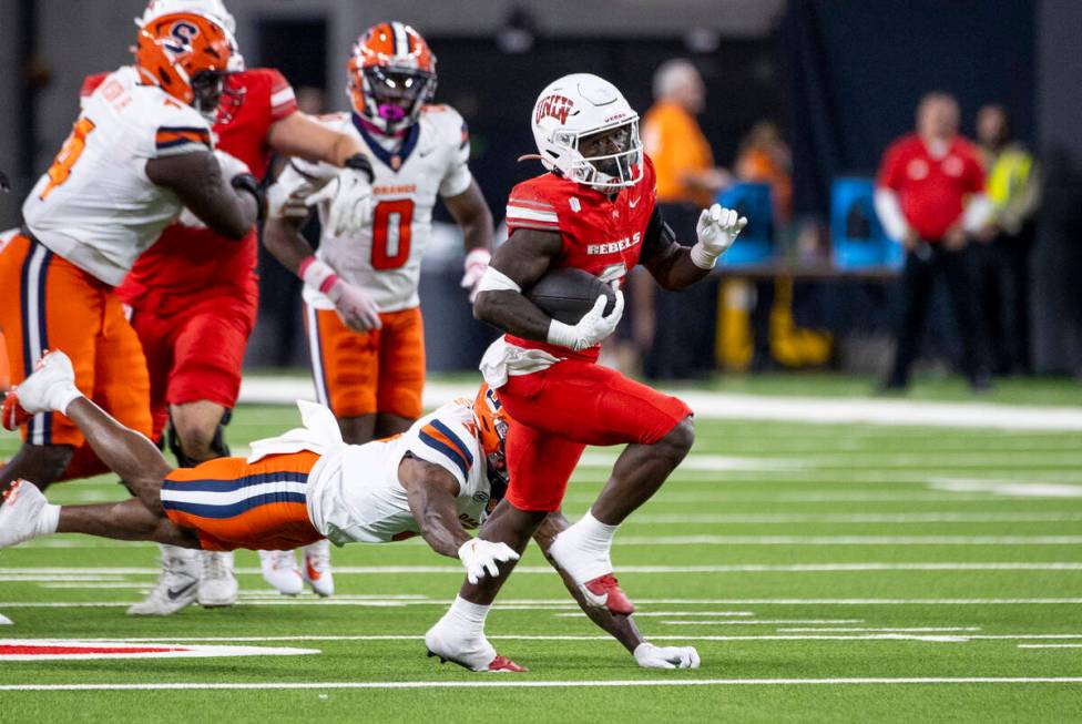 UNLV running back Jai'Den Thomas (9) runs the ball during the college football game against the ...