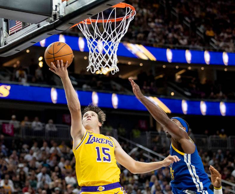 Los Angeles Lakers guard Austin Reaves (15) shoots a layup during the NBA preseason basketball ...