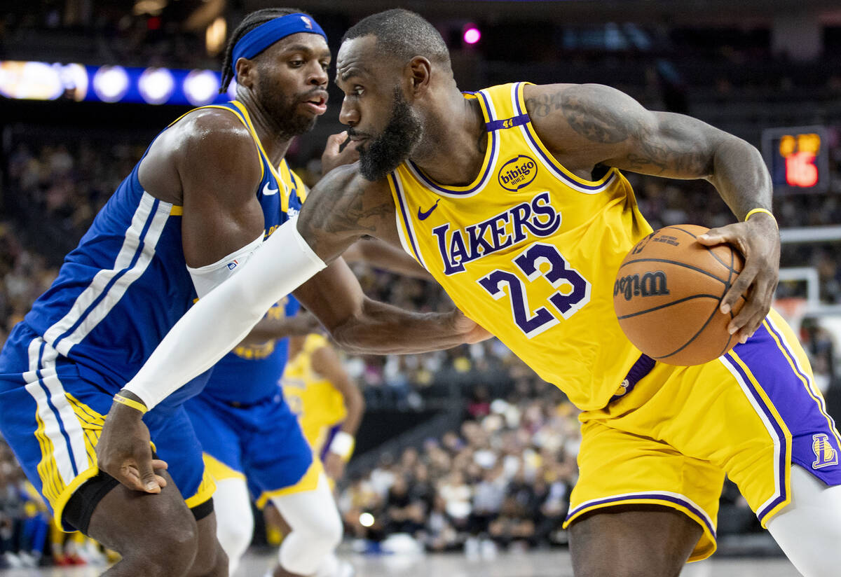 Los Angeles Lakers forward LeBron James (23) attempts to pass Golden State Warriors guard Buddy ...