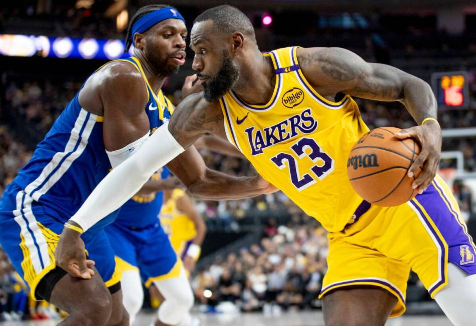 Los Angeles Lakers forward LeBron James (23) attempts to pass Golden State Warriors guard Buddy ...