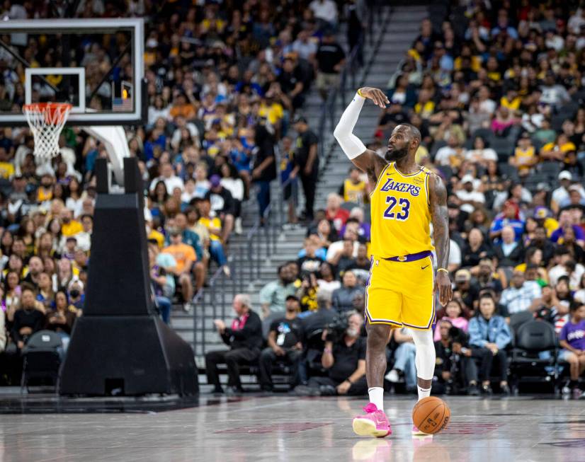 Los Angeles Lakers forward LeBron James (23) directs the team during the NBA preseason basketba ...