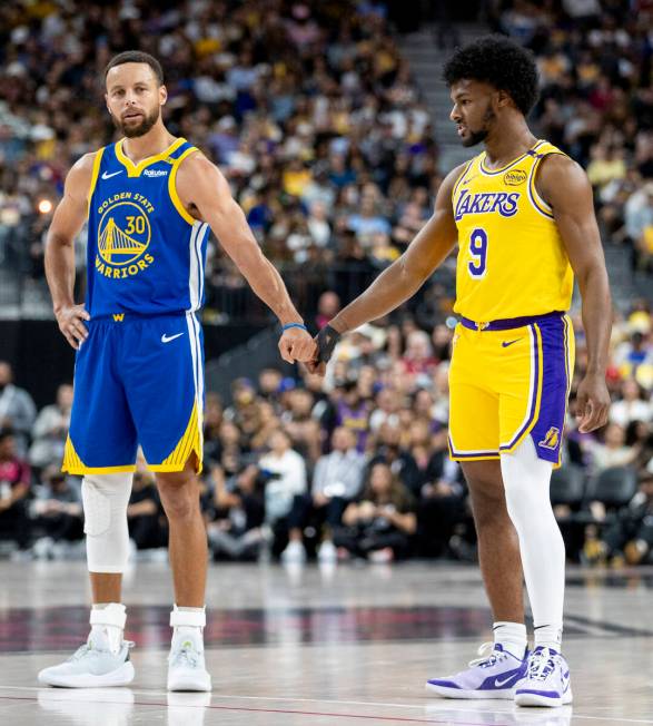 Golden State Warriors guard Stephen Curry (30) and Los Angeles Lakers guard Bronny James Jr. (9 ...