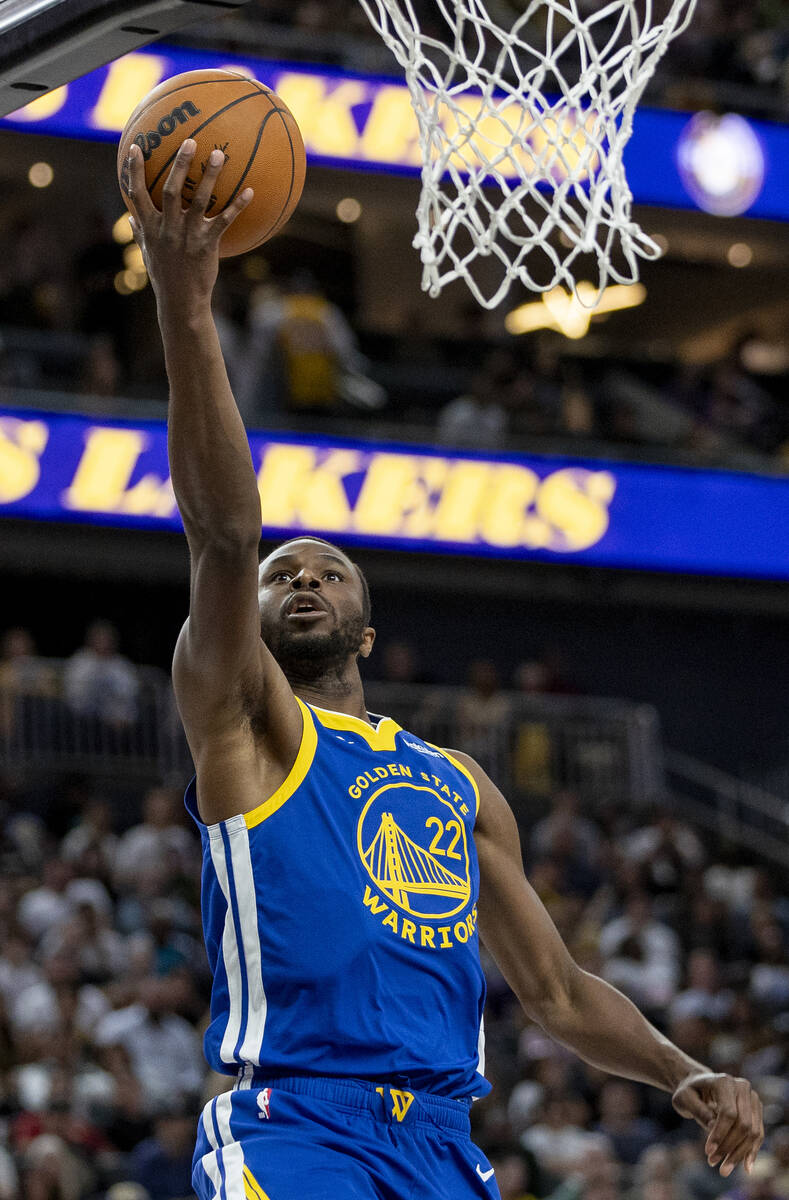 Golden State Warriors forward Andrew Wiggins (22) attempts a layup during the NBA preseason bas ...