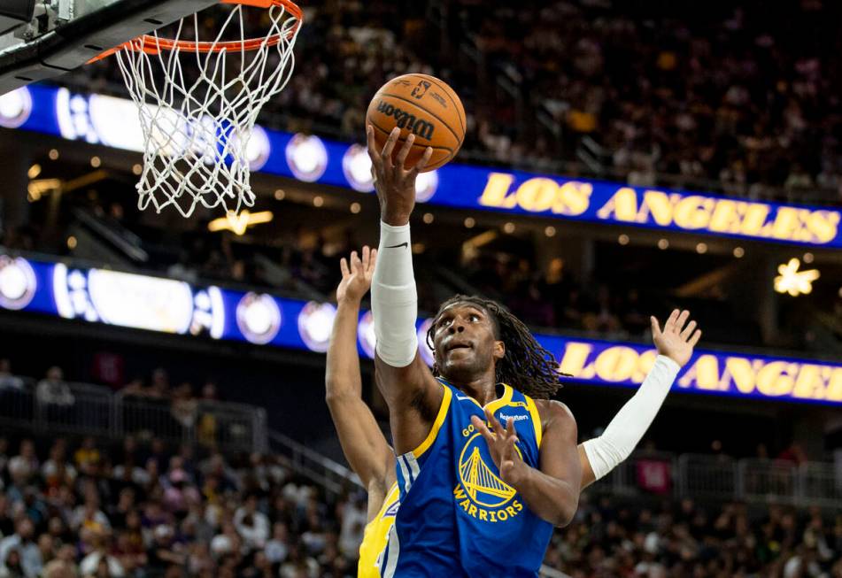 Golden State Warriors forward Kevon Looney (5) attempts a layup during the NBA preseason basket ...