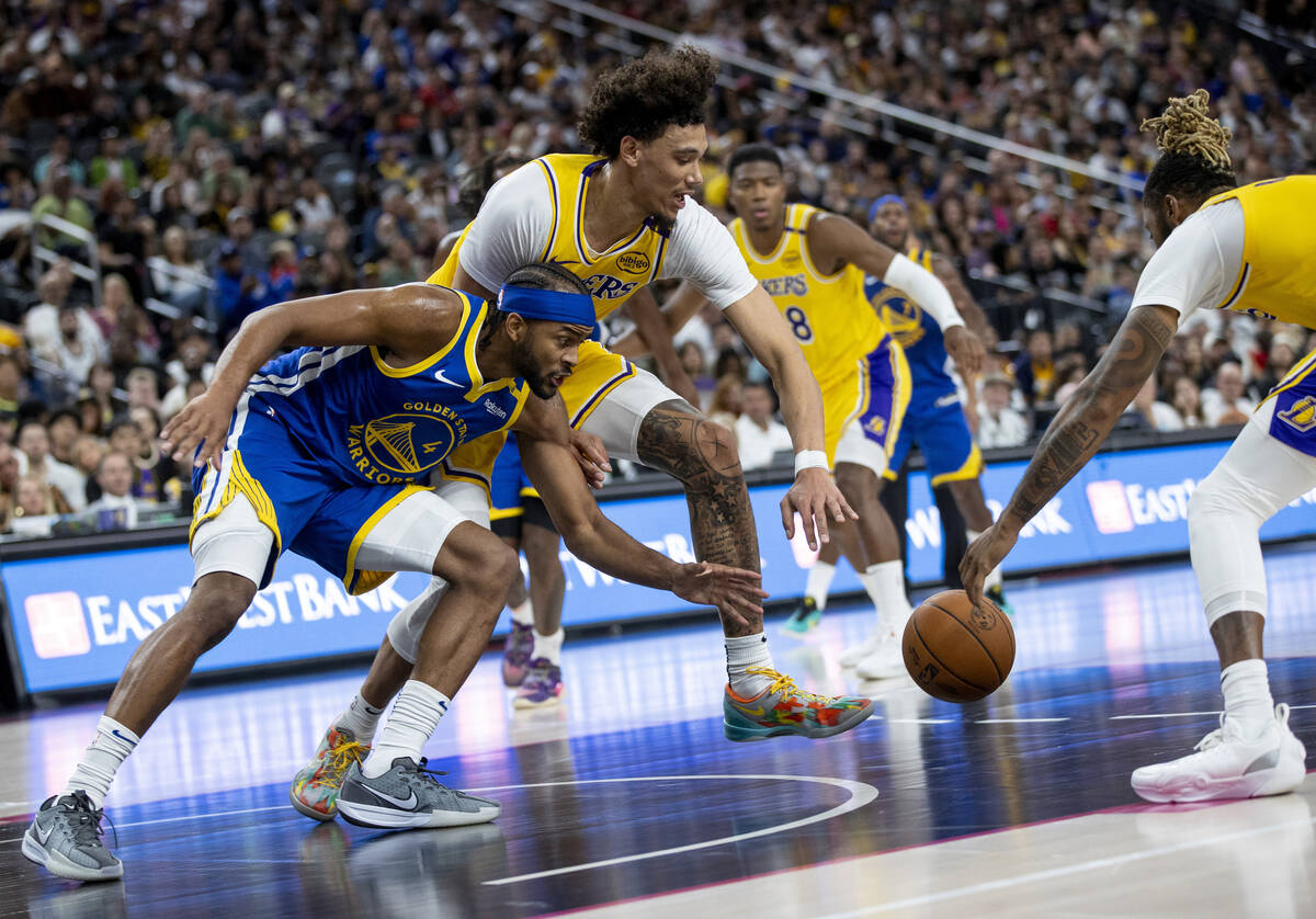 Golden State Warriors guard Moses Moody (4) and Los Angeles Lakers center Jaxson Hayes (11) div ...