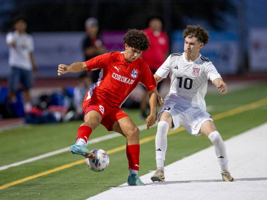 Coronado junior Dylan Flores (9) and Las Vegas High senior Daniel Murillo (10) compete for the ...