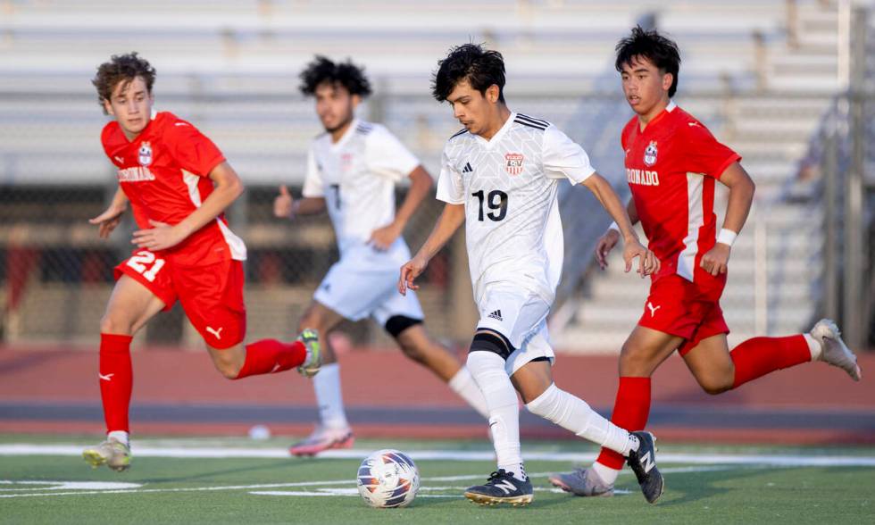 Las Vegas High junior Lex Madrigal (19) controls the ball during the high school soccer game ag ...