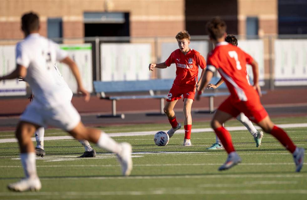 Coronado midfielder Liam Bringhurst (12) looks to pass the ball during the high school soccer g ...