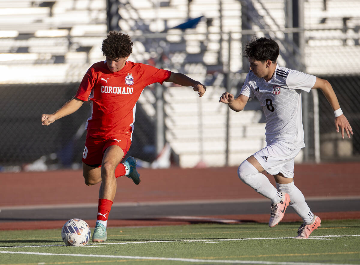 Coronado junior Dylan Flores (9) keeps the ball from Las Vegas High midfielder Oscar Sandoval ( ...