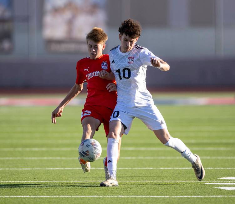 Las Vegas High senior Daniel Murillo (10) rushes Coronado midfielder Liam Bringhurst (12) durin ...