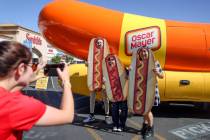 Hotdogger Ann Kerr takes a photo of Ben Mione, from left, his girlfriend Elizabeth Villagrana, ...