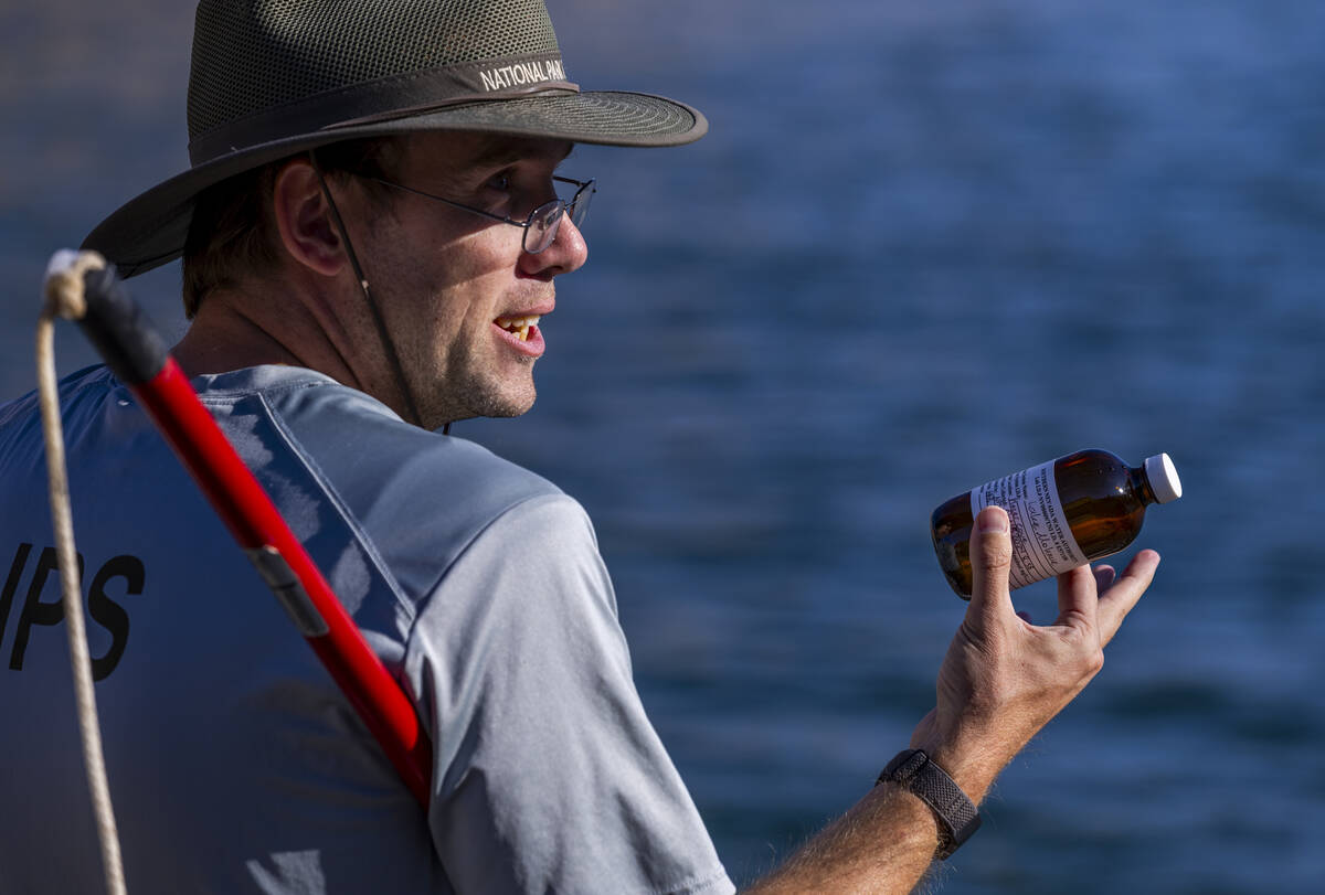 Aquatic Ecologist Riley Rackliffe with the National Park Service holds another water sample whi ...