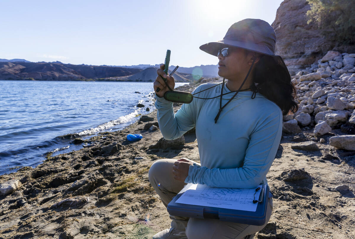 Technician Ariel Santero with the American Conservation Experience takes a wind reading while w ...