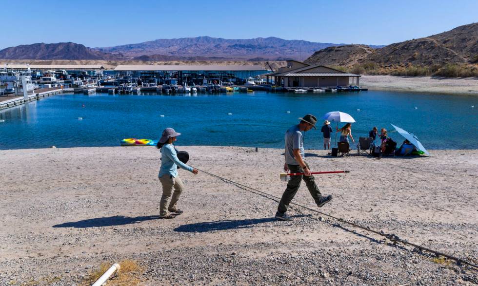 Aquatic Ecologist Riley Rackliffe with the National Park Service teams up with technician Ariel ...