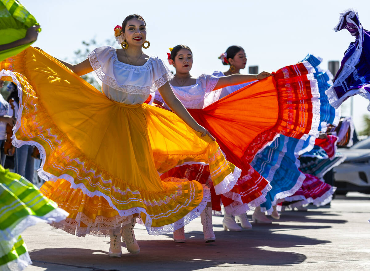 Student Folklorico dancers backed up by a mariachi band perform at the Silver State Education F ...