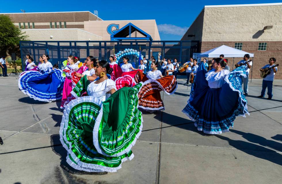 Student Folklorico dancers backed up by a mariachi band perform at the Silver State Education F ...