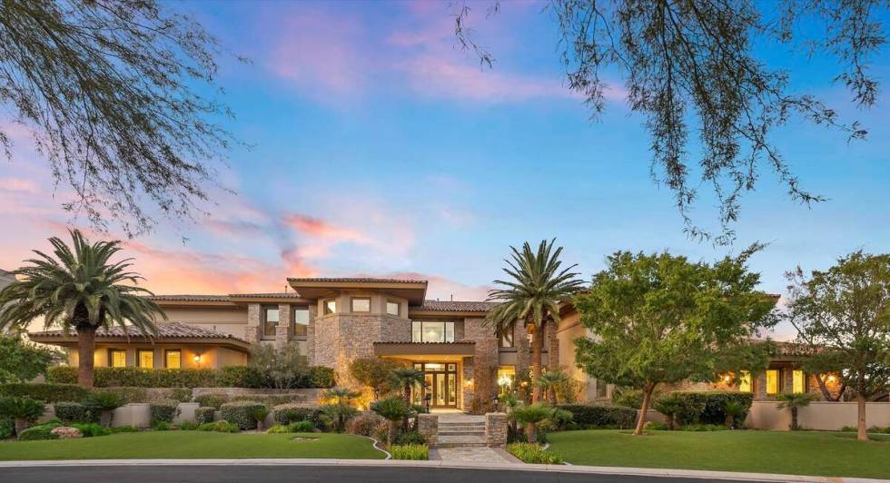 The 12,707-square-foot Southern Highlands house has five bedrooms, eight bathrooms and a five-c ...