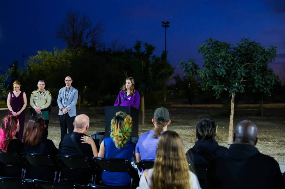 The names of 34 victims of domestic violence who lost their lives are read during a tree dedica ...