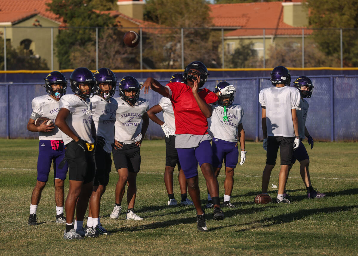 Quarterback Alexander Mercurius throws the ball during football practice at Durango High School ...