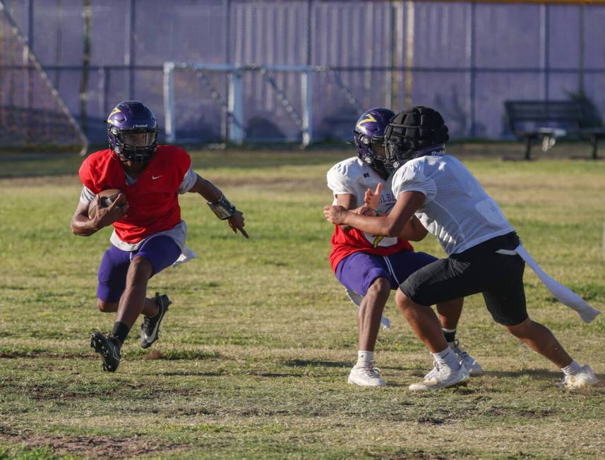 Quarterback Alexander Mercurius carries the ball during football practice at Durango High Schoo ...