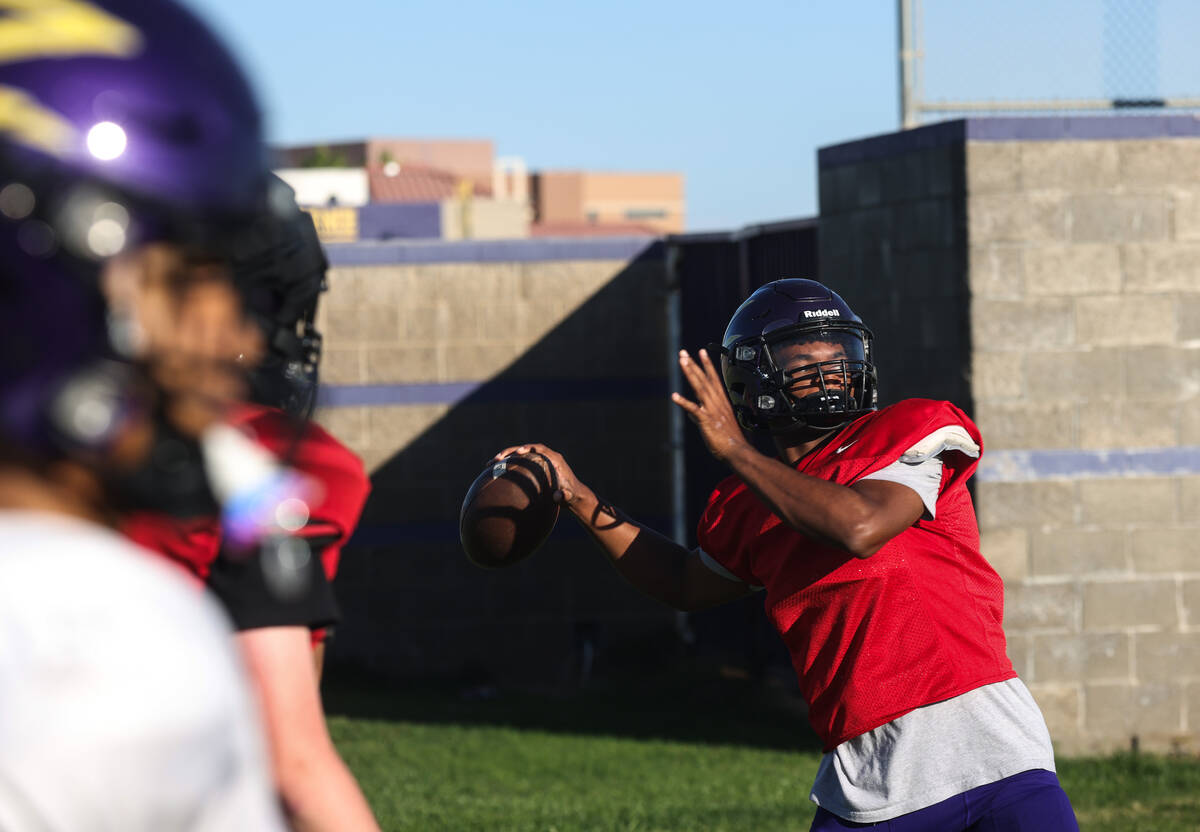 Quarterback Alexander Mercurius winds up to throw the ball during football practice at Durango ...