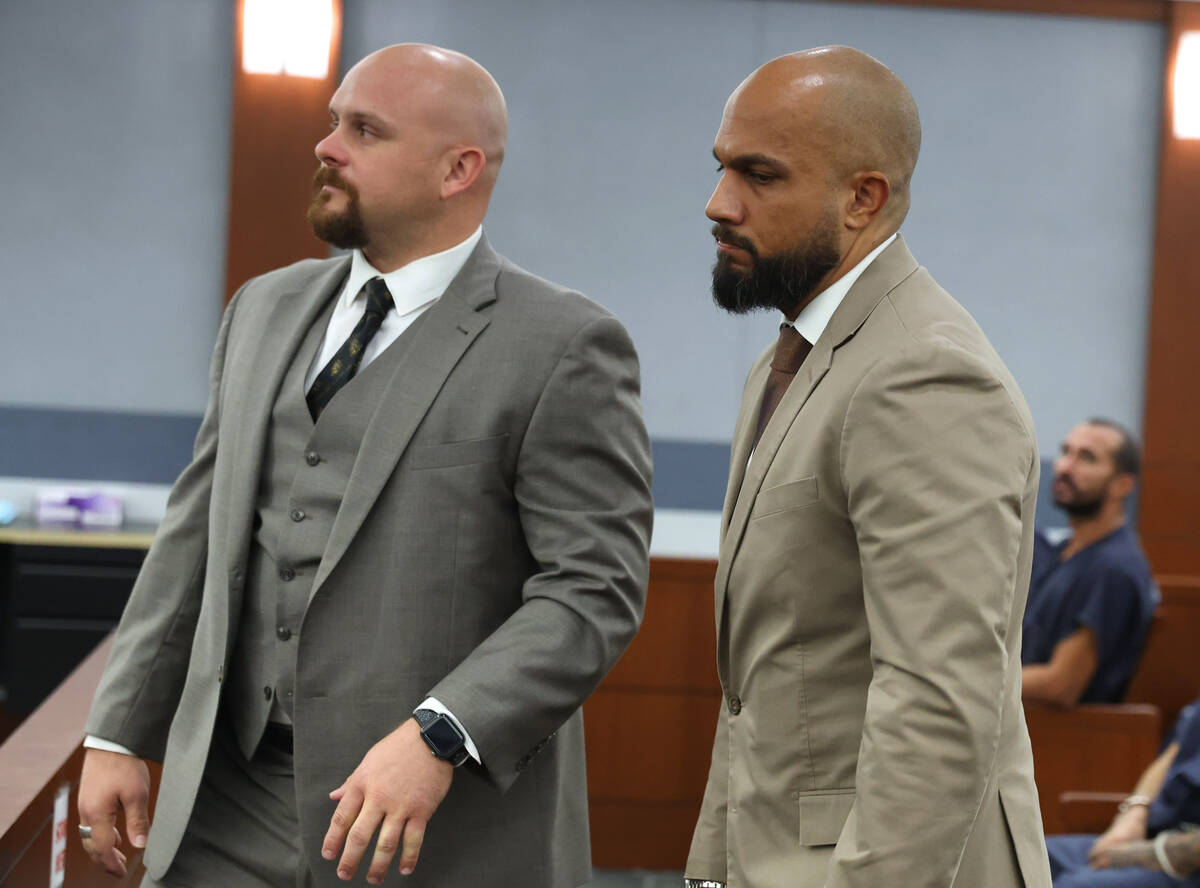 Sgt. Kevin Menon, right, appears in court with his attorney Austin Barnum during a preliminary ...