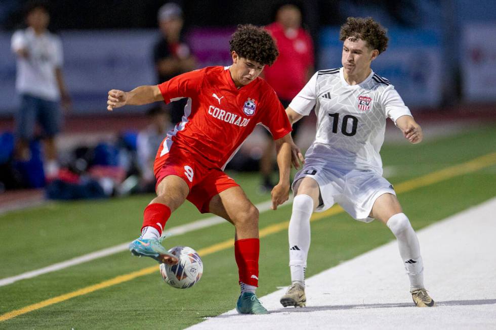 Coronado junior Dylan Flores (9) and Las Vegas High senior Daniel Murillo (10) compete for the ...