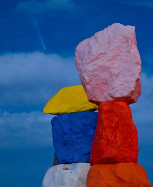 "Seven Magic Mountains," by artist Ugo Rondinone, is illuminated by a supermoon as Comet Tsuchi ...