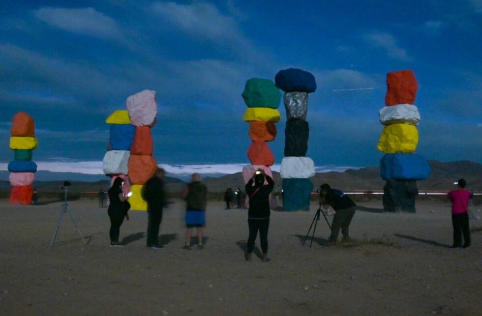 People gather at Seven Magic Mountains to watch and photograph Comet Tsuchinshan-Atlas Wednesda ...