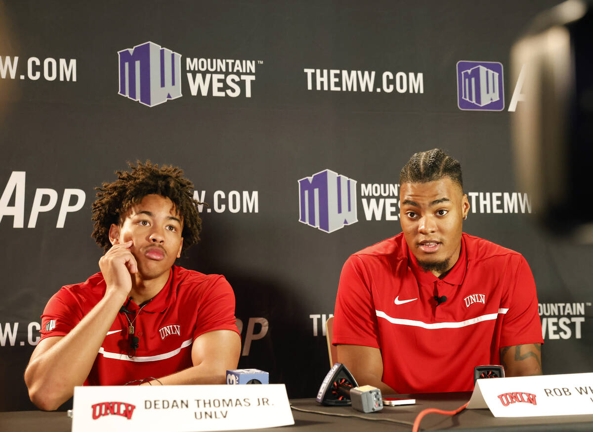 UNLV Rebels forward Rob Whaley Jr. speaks as guard Dedan Thomas Jr., left, looks on during the ...