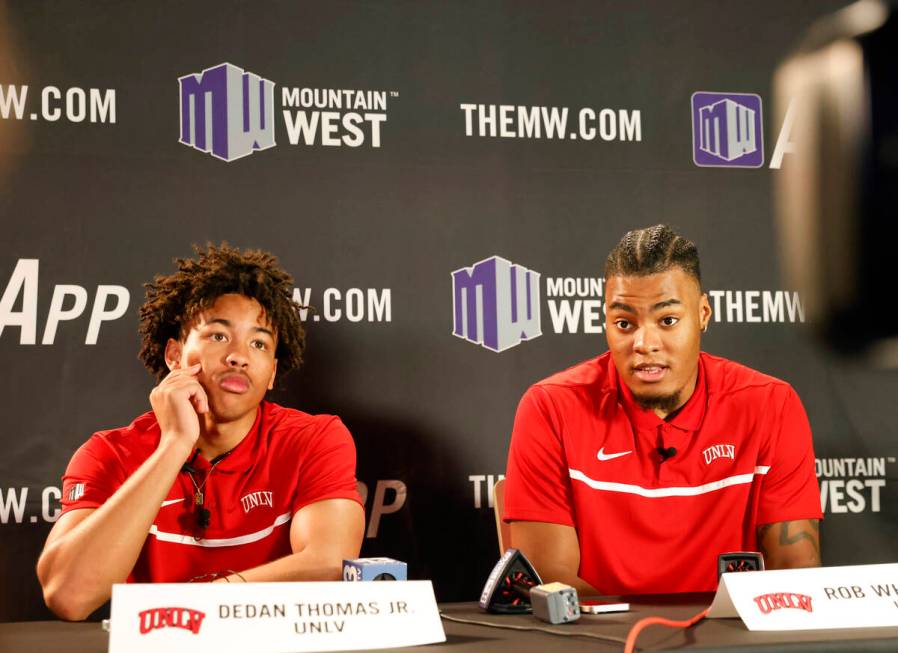 UNLV Rebels forward Rob Whaley Jr. speaks as guard Dedan Thomas Jr., left, looks on during the ...