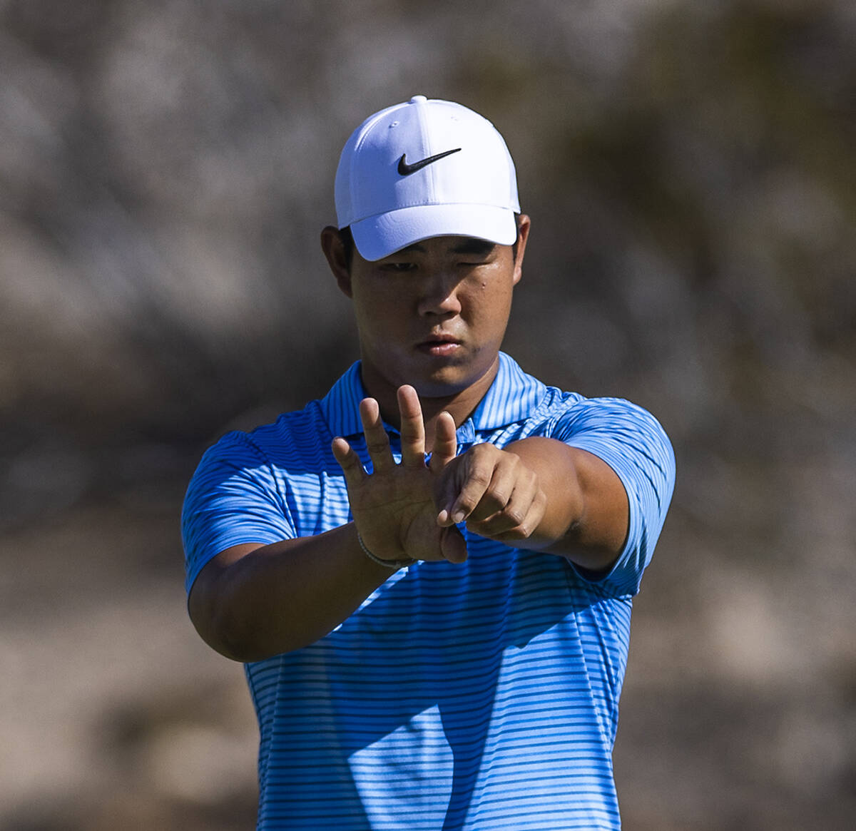 Tom Kim lines up a shot on hole #6 during the opening round of the Shriners Children's Open at ...