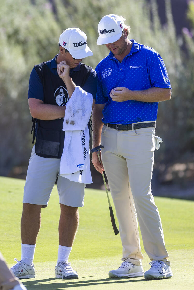 Trey Mullinax chats with his caddie at hole #7 during the opening round of the Shriners Childre ...